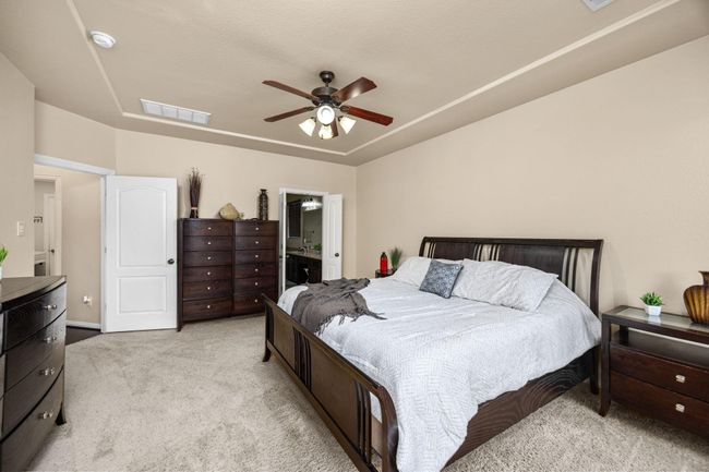 Primary bedroom entrance and double doors leading into the primary bath. | Image 20
