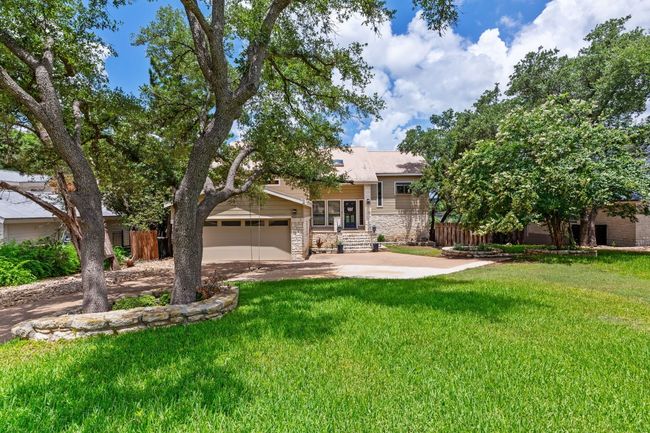 Large front yard with mature trees. | Image 7