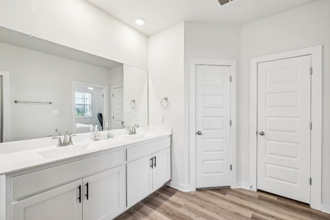 Unwind in your luxurious spa-like bathroom with dual vanities and ample storage. | Image 22