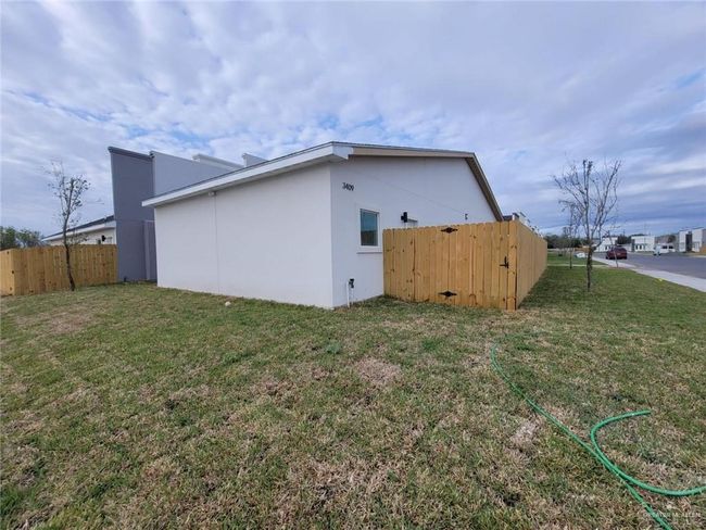 View of side of property featuring stucco siding | Image 11