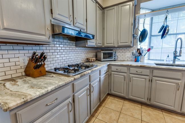 Tons of storage space and large window and huge country kitchen sink. | Image 7