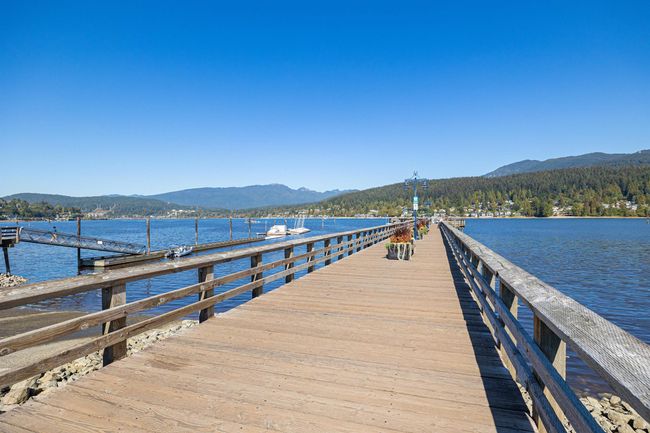 Dock featuring a water and mountain view | Image 27