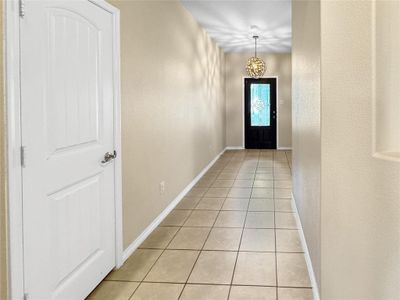 Doorway to outside with light tile patterned floors | Image 3