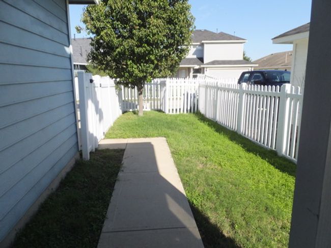 View of yard - This is an old photo of the backyard from several years ago. | Image 26