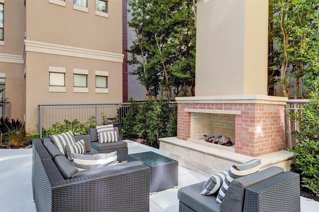 Cozy outdoor areas featuring fireplaces and BBQ grills—perfect for entertaining. | Image 25