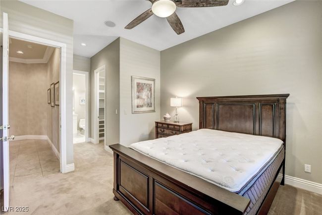 Bedroom featuring recessed lighting, connected bathroom, ceiling fan, baseboards, and light colored carpet | Image 36