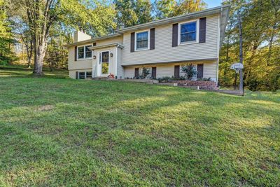 Bi-level home featuring a front yard | Image 2