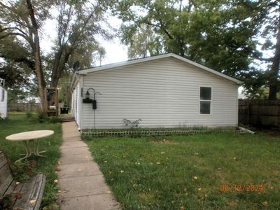 View of side of home featuring a lawn | Image 2