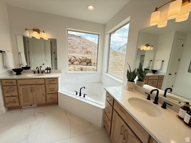 Full bathroom featuring marble finish floor, a sink, a bath, and recessed lighting | Image 13