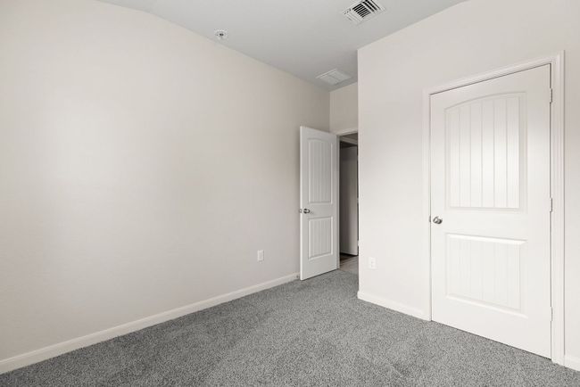 Unfurnished bedroom featuring carpet floors and baseboards | Image 5