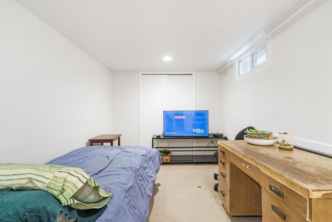 Bedroom with concrete flooring and recessed lighting | Image 26