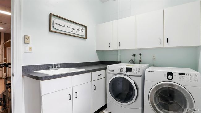 Laundry room with cabinet space and separate washer and dryer | Image 8