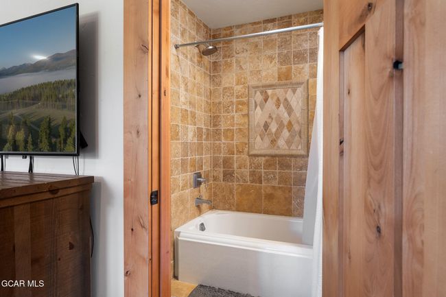 above garage full bath with large tub | Image 30