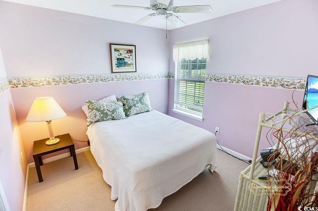 Carpeted bedroom with baseboards and ceiling fan | Image 21