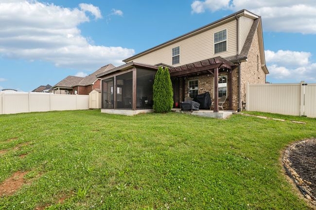 The fully privacy-fenced backyard offers a safe and spacious area, perfect for kids and pets to play. 1107 Sycamore Leaf Way Murfreesboro, TN 37129 | Image 36