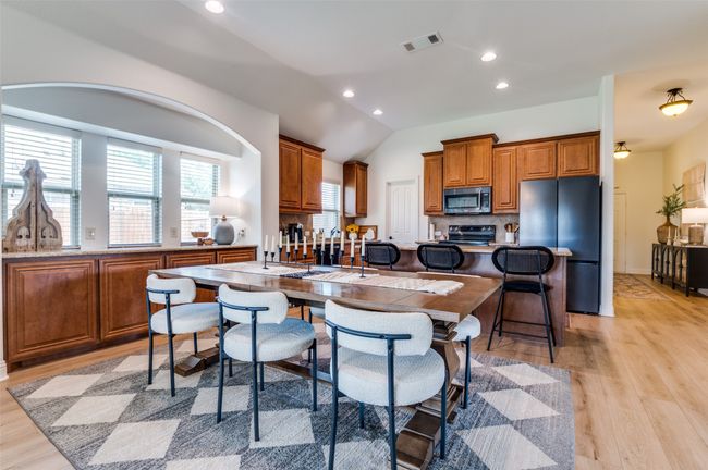 Extended kitchen bar area with loads of storage and ample dining space! Open with lots of natural light! | Image 5