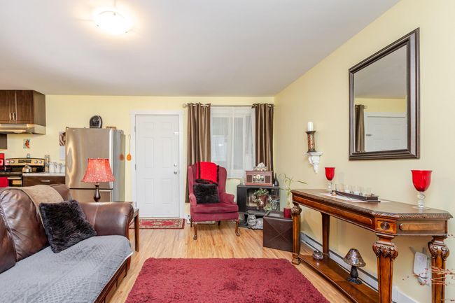 Living area with light wood-style flooring | Image 21