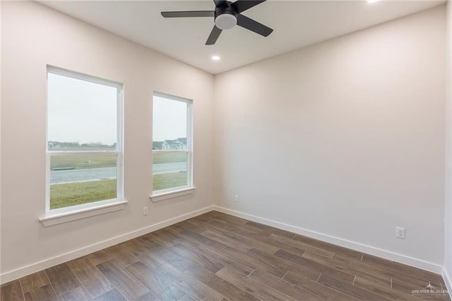 Spare room with ceiling fan | Image 19