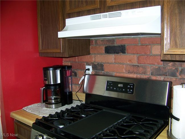 Kitchen with gas range | Image 5