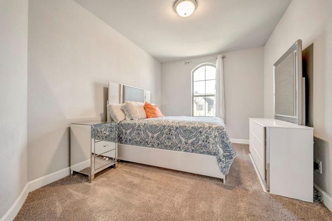 Upstairs bedroom with walk-in closet. Overlooks the front yard. | Image 24