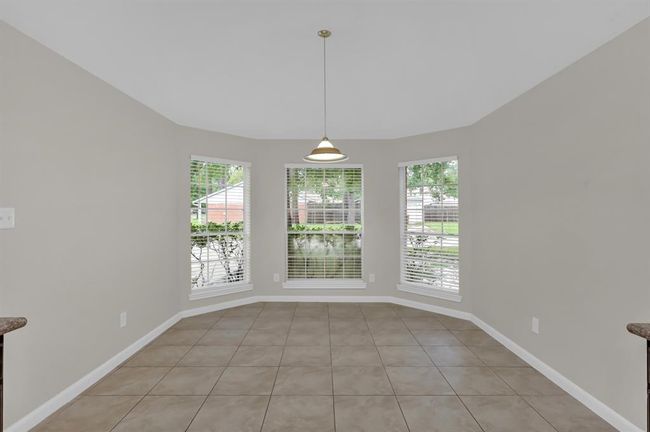 Breakfast area with bay windows to the front of the house. | Image 21