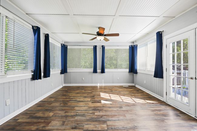 View of unfurnished sunroom | Image 16