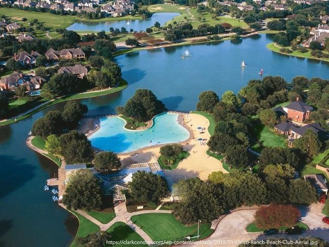 Cinco Ranch residents can also enjoy one of the first amenities built in the master planned community, the Beach Club with a half-acre swim lagoon, a white sand beach, picnic facilities and more! There are boat docks (paddle boats/kayaks) available during Beach Club Pool Hours. | Image 32