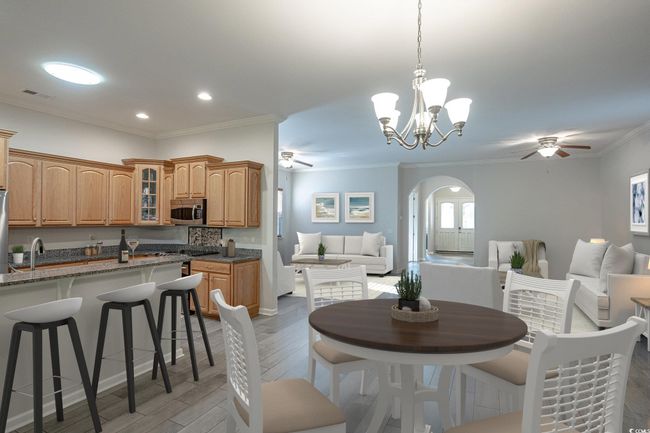 Virtually staged example of dining area with possible option for furniture placement. | Image 23
