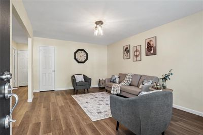 Living room featuring hardwood / wood-style flooring | Image 2