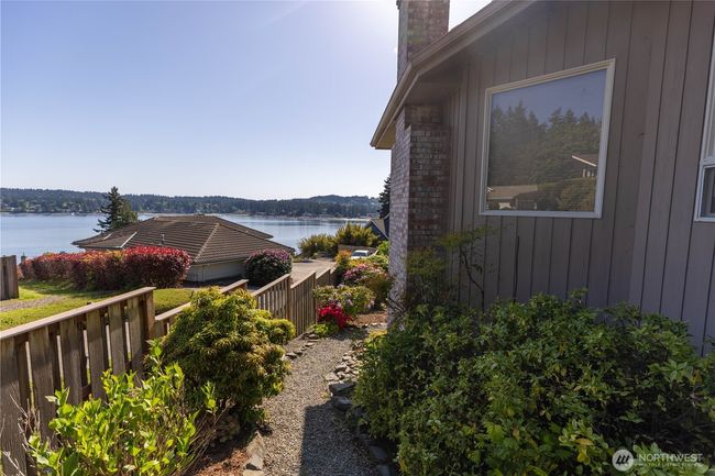 Walking path on the left side of the home to the spacious backyard | Image 10