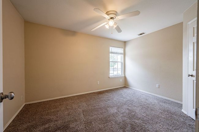 Spare room with carpet, ceiling fan, and baseboards | Image 24
