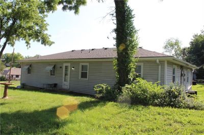 Rear view of property featuring a lawn | Image 2