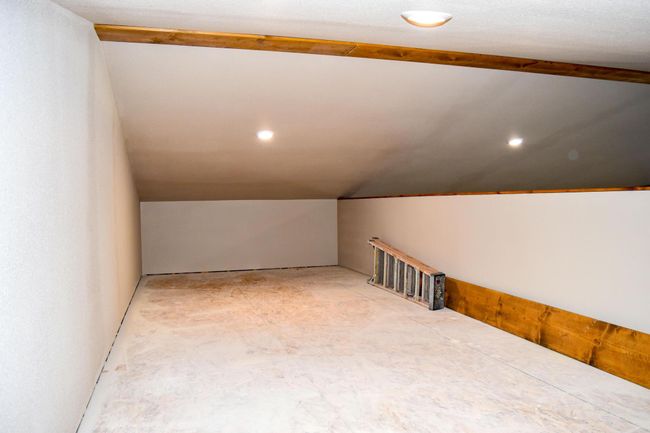 Additional living space with recessed lighting and lofted ceiling | Image 28