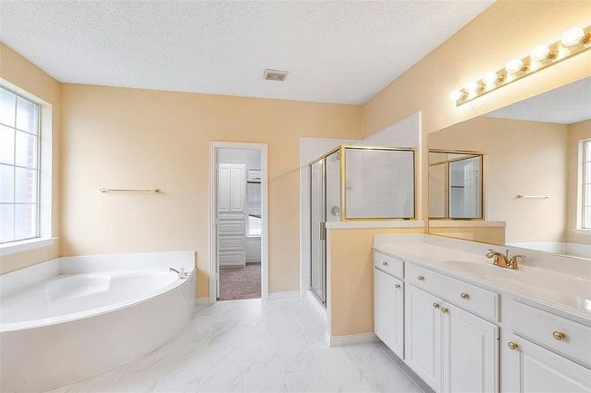 Bathroom with a shower stall and plenty of natural light | Image 15