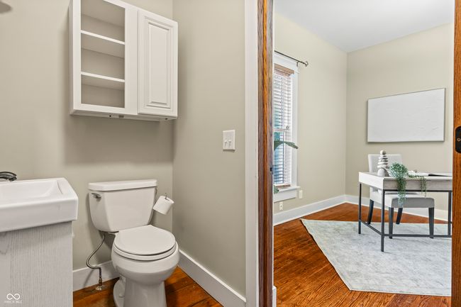 bathroom with dark wood-style floors and baseboards | Image 24