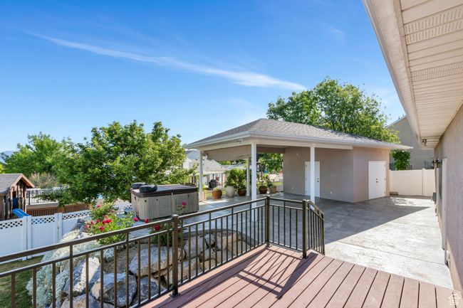 Wooden deck with a patio area | Image 23