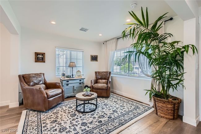 Living area with wood finished floors, baseboards, and recessed lighting | Image 24