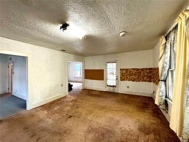 Peek into 2nd bedroom and dining room from the living area | Image 11