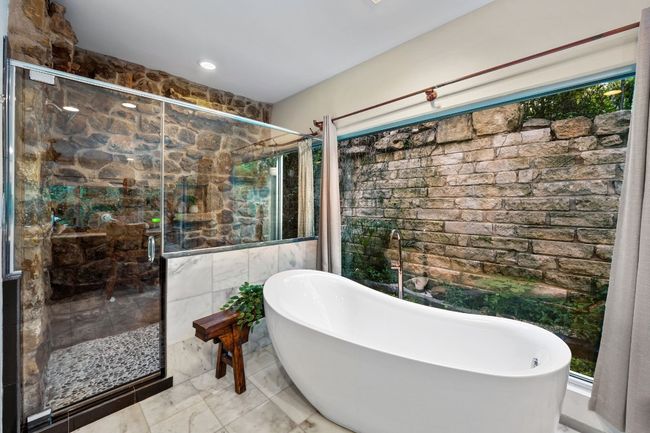 Enjoy the view while you soak or pull the curtains for privacy. | Image 25