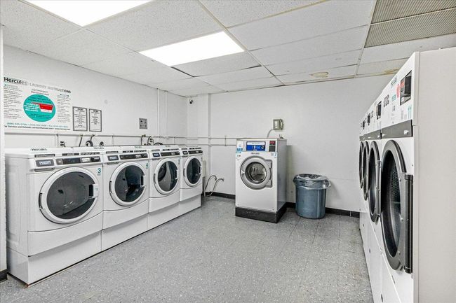 Community laundry with independent washer and dryer and light floors | Image 11