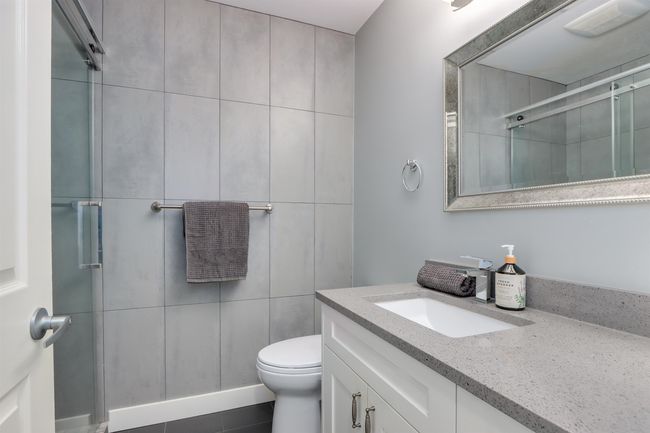 Bathroom featuring vanity and a stall shower | Image 18