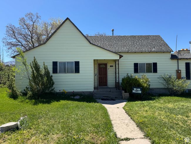 Bungalow-style house with a front yard and a shingled roof | Image 23