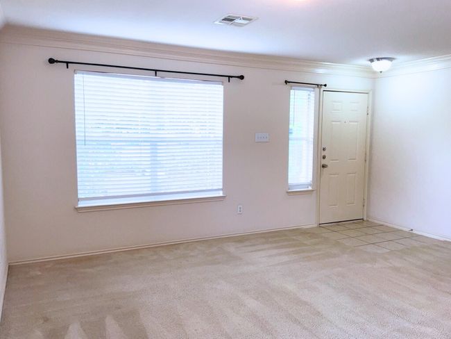 Living room featuring ornamental molding and carpet floors | Image 5