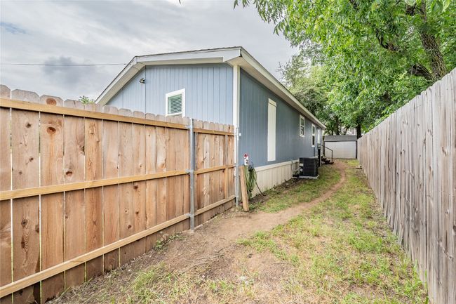 View of fenced backyard | Image 28