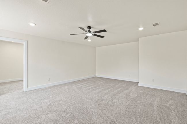 Unfurnished room featuring carpet flooring, a ceiling fan, and recessed lighting | Image 16