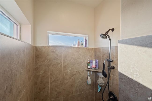 Bathroom with a tile shower | Image 23