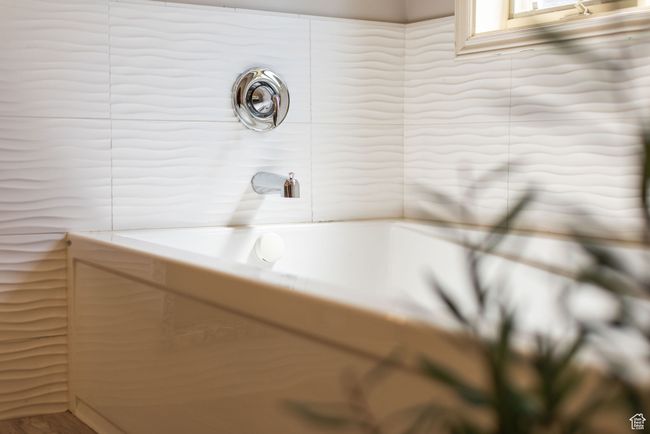 Full bathroom with tile walls | Image 38
