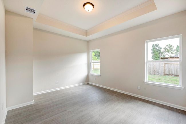 The Davenport II- Primary Suite with Tray Ceiling. Home under construction. Sample floor plan photo used for illustrative purposes only. Upgrades, selections options, windows and colors may vary. | Image 8
