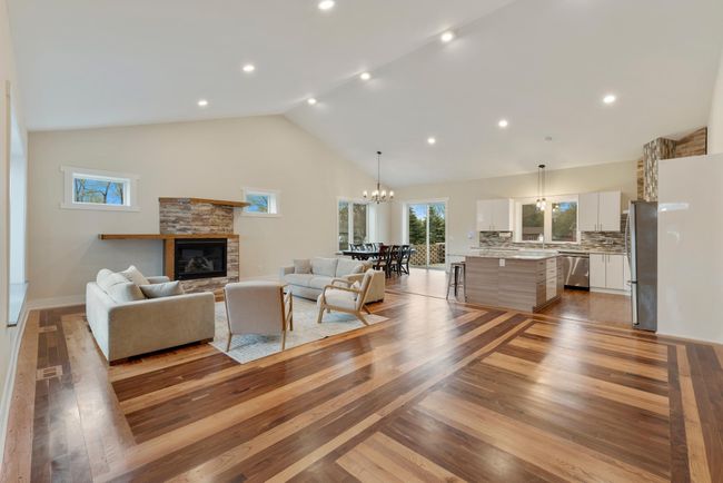 Hand cut & handcrafted 1946 American Walnut welcomes you in the living room along with a beautiful stone fireplace | Image 7