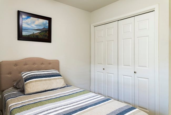 Bedroom with a closet | Image 17